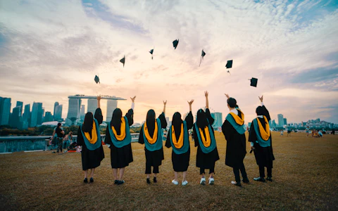 Graduates throwing their caps in the air